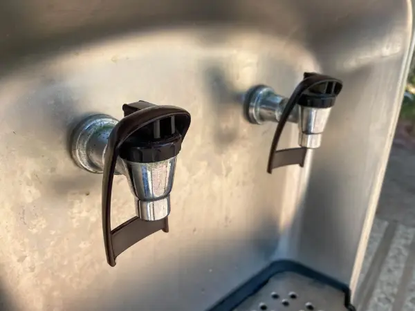 Outdoor metal water filling station