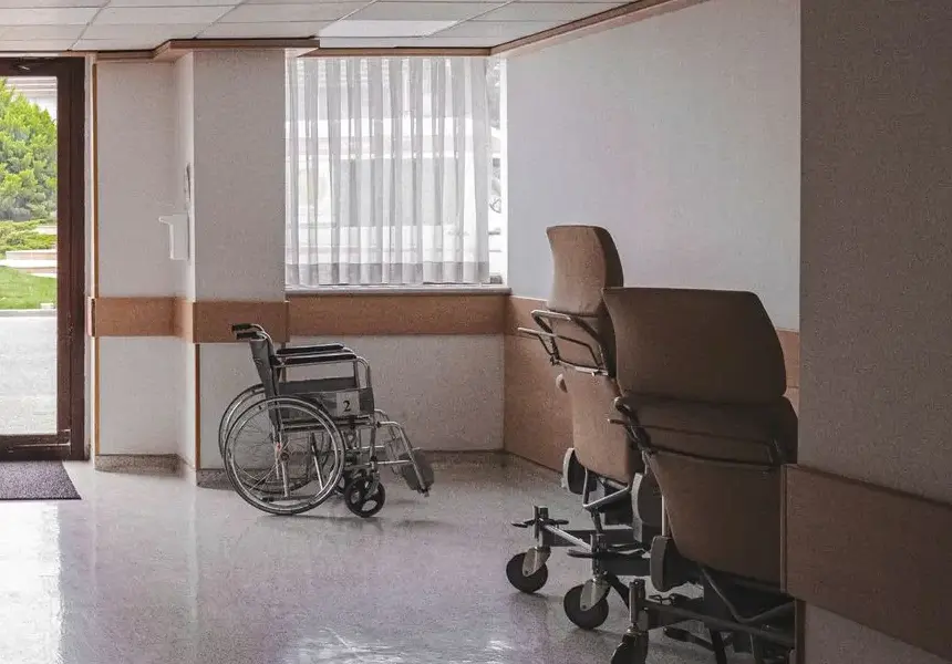 3 wheelchairs in a care home hallway