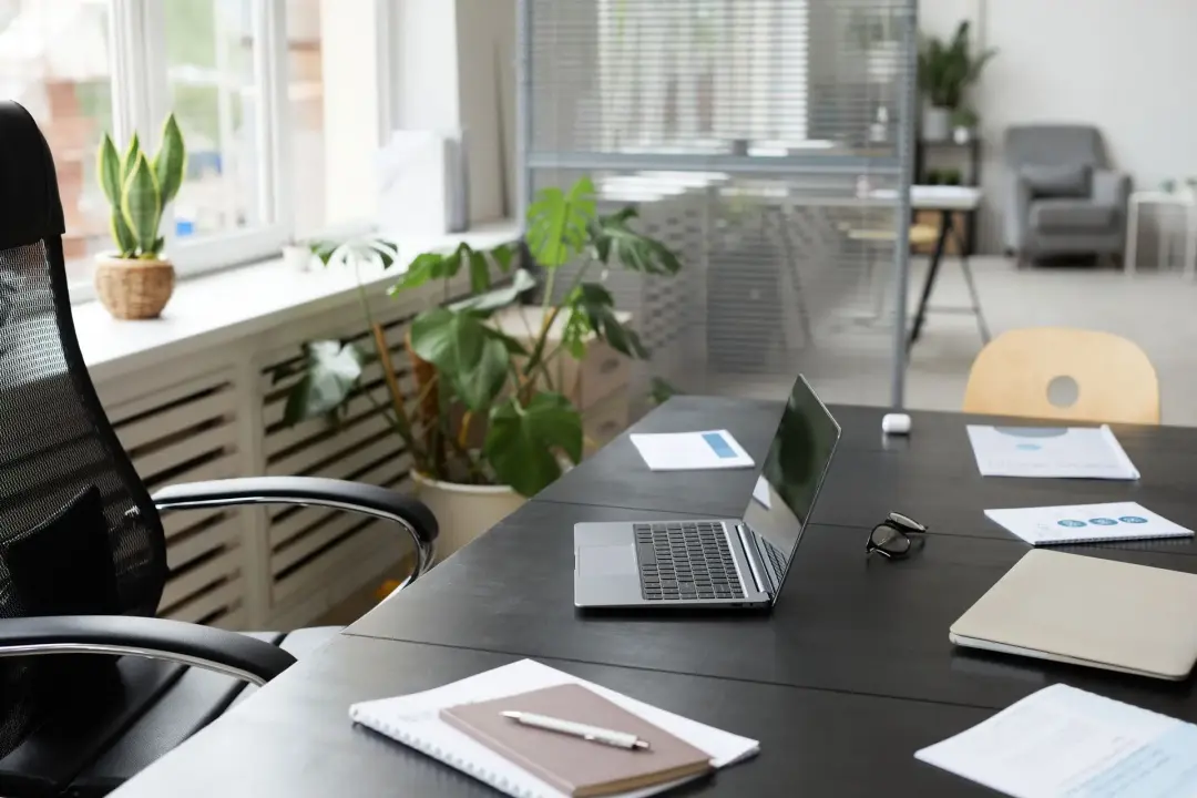 Modern office space with laptop and other stationery
